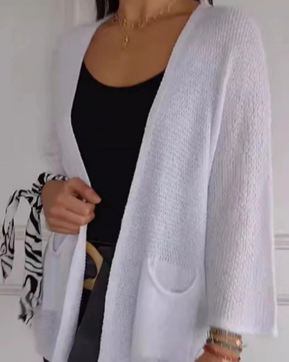 Kényelmes, nyitott elülső részű kötött kabát